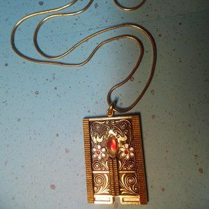 GOLDTONE FLORAL PENDANT SERPENTIN NECKLACE